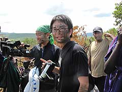 In order to bless our director and cameraman, the village chief kindly blessed them by rubbing cow excrement on their faces too.